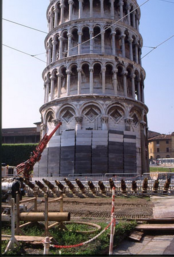 Picture of the leaning tower of Pisa during the renovation process with restoring the lean and ensuring that no acceleration is observed