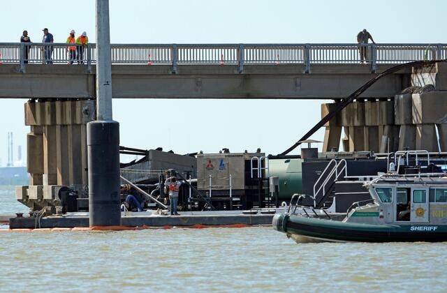 Barge showing the ship allison happening in the bridge connecting the town of Galveston with Pelican island.